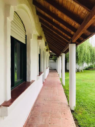 a hallway of a building with a wooden roof at Sauce Viejo in Mina Clavero