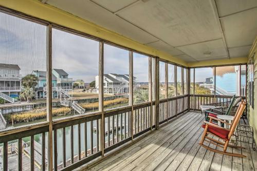 A balcony or terrace at Canalfront Sunset Beach Home Steps to Ocean!