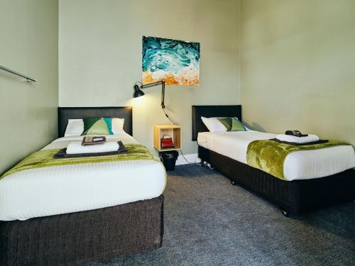 Ένα ή περισσότερα κρεβάτια σε δωμάτιο στο Black Diamond Lodge