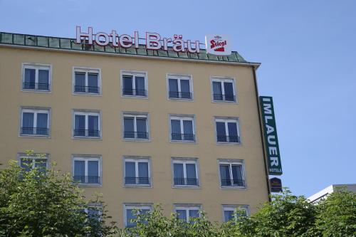 a hotel building with a sign on top of it at Hotel IMLAUER & Bräu in Salzburg