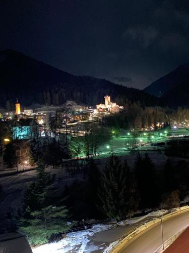 a view of a city at night with lights at B&B el Benel in Ossana