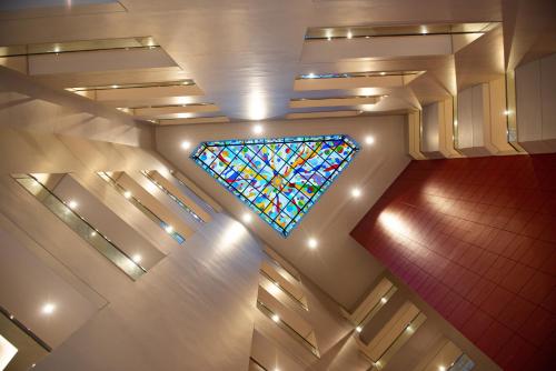 a stained glass window on the ceiling of a church at ROZANA HOTEL in Muscat