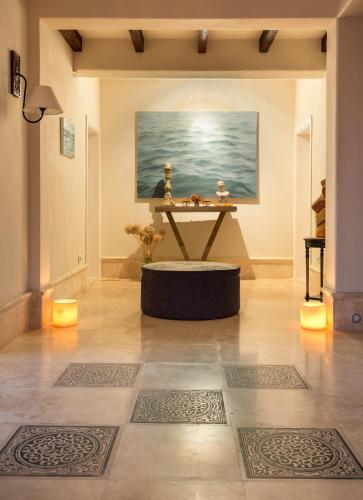 a room with a table and a painting on the wall at LuCe Design Hotel - Special Category in Alacati