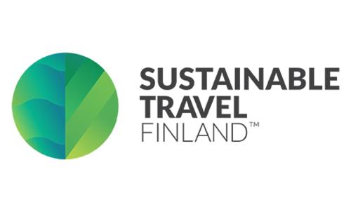 a green circle with the words sustainable travel finland at Säynätsalo Town Hall in Säynätsalo