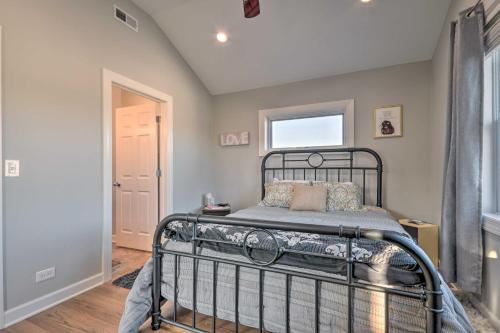 a bedroom with a bed and a window at Third-Floor Chicago Condo Walk to CTA Stations! in Chicago