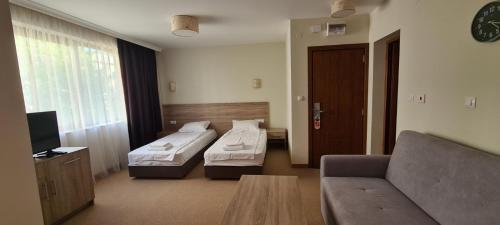 Postel nebo postele na pokoji v ubytování Hotel Geppy