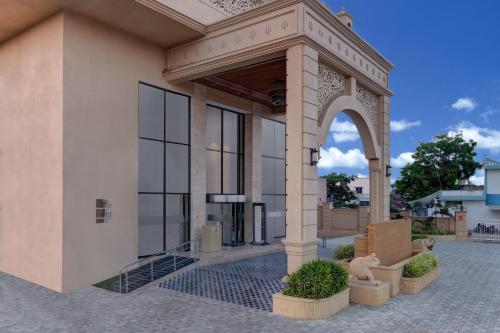 an entrance to a building with an arch at Lemon Tree Premier, Dwarka in Dwarka