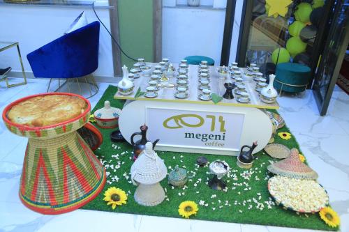a table with a sign and some items on it at Base Ethiopia International Hotel in Addis Ababa