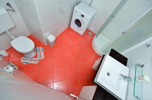 an overhead view of a bathroom with a toilet and a shower at Vila Dunja in Makarska