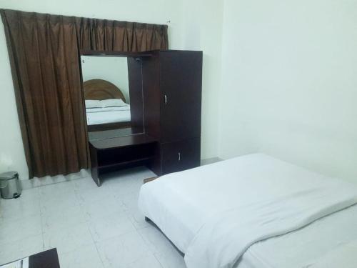 Richmond Hotel Sylhetにあるベッド