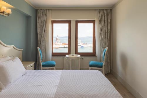 Säng eller sängar i ett rum på Hotel Limani