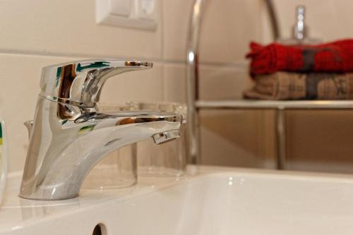a bathroom sink with a chrome bathroom faucet at Wofahanslhof in Eschlkam