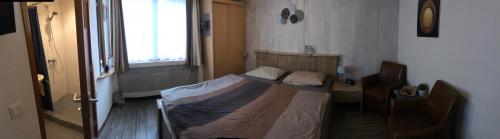 
Een bed of bedden in een kamer bij Hotel Pieter de Coninck
