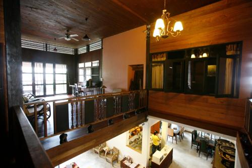 an overhead view of a living room with wooden walls at Baan Hanibah in Chiang Mai