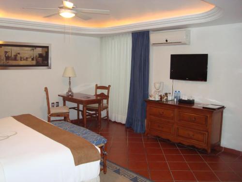 Μια τηλεόραση ή/και κέντρο ψυχαγωγίας στο Hotel Boutique Casa de Campo