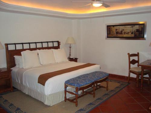 Ένα ή περισσότερα κρεβάτια σε δωμάτιο στο Hotel Boutique Casa de Campo