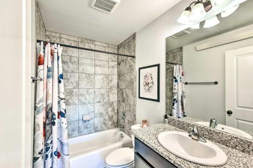 a bathroom with a sink and a tub and a toilet at Modern Poncha Springs Townhome with Mtn Views! in Salida