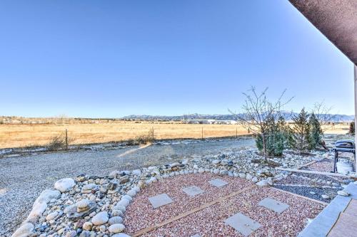 a view of a yard with rocks and a field at Modern Poncha Springs Townhome with Mtn Views! in Salida