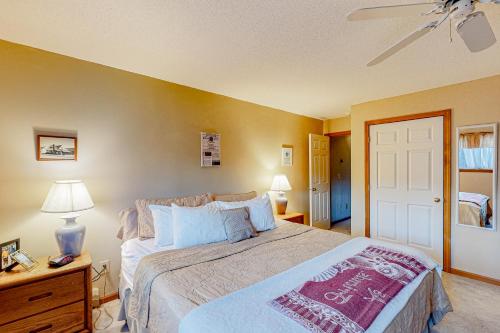 a bedroom with a bed and a ceiling fan at Timber Creek #98 in Dover