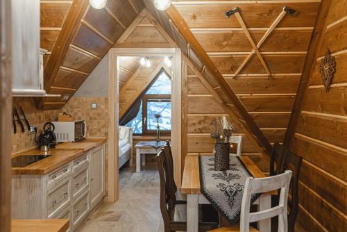 a kitchen with a dining table in a tiny house at TatrApart in Zakopane
