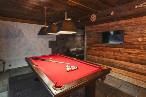a billiard table in a room with a pool at TatrApart in Zakopane