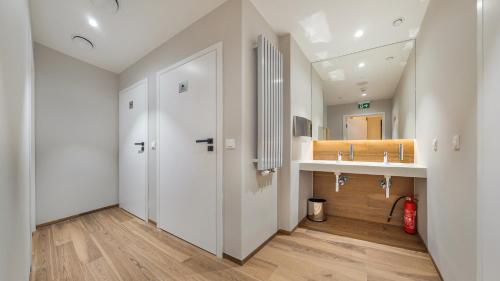 a bathroom with a sink and a mirror at Nexo, Sun & Snow in Puck