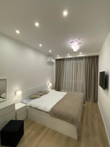 Katil atau katil-katil dalam bilik di VIP apartment in Odessa