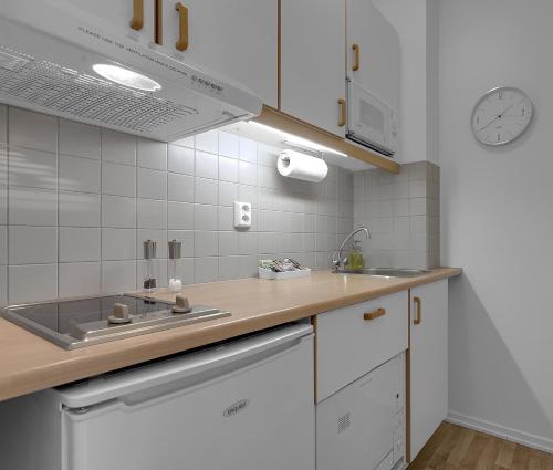 a kitchen with a sink and a counter top at Castle House Luxury Apartments in Reykjavík