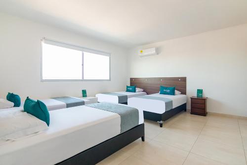 Un pat sau paturi într-o cameră la Ayenda Elyamar V