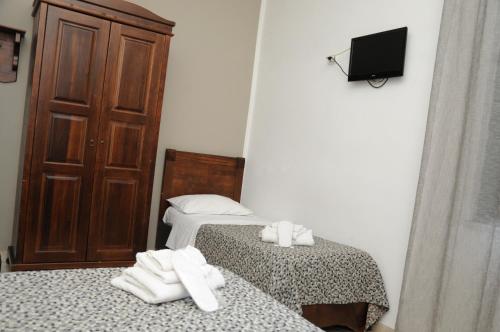 Säng eller sängar i ett rum på Hotel Sannita