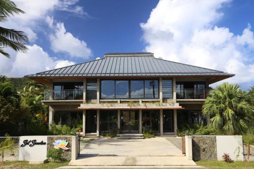 a house with a metal roof on top of it at Sol Sanctum - Boutique Wellness Hotel in Gros Islet