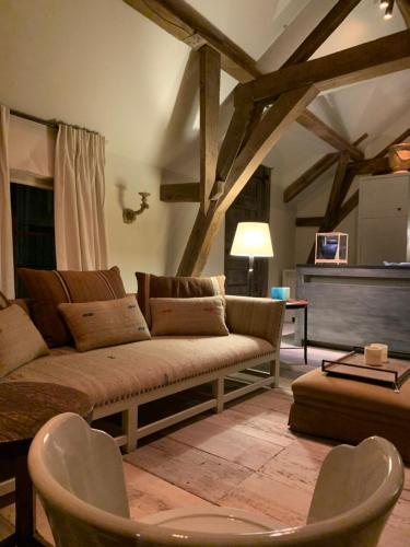 a living room with a couch and a table at B&B The Verhaegen in Ghent