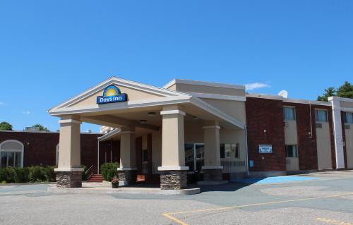a building with a sign on top of it at Days Inn by Wyndham Bridgewater Conference Center in Bridgewater