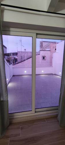 a window in a room with a view of a building at Appartamenti Mascagni in Sannicandro di Bari
