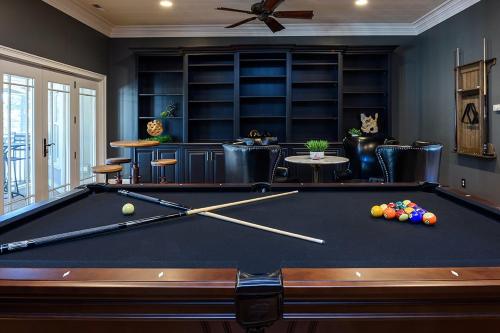 a billiard room with a pool table in it at New - Spectacular️ Golf Views - Sleeps 20 - Pinehurst National #9 - Near DT Pinehurst! in Pinehurst