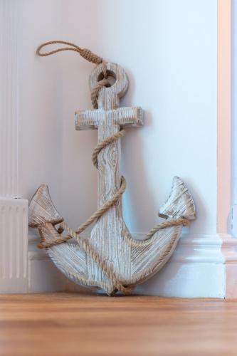 a wooden sculpture of a boat on a wall at Turnberry accommodation in Turnberry