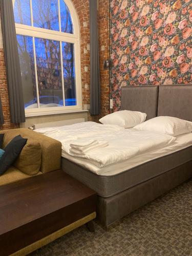 Postel nebo postele na pokoji v ubytování KobyLoft stylisches Apartment Herford City, barrierefrei&Parkplatz