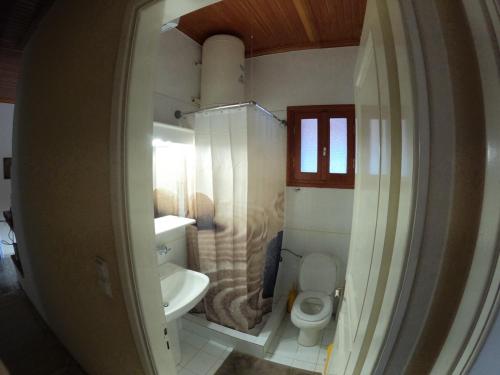 a small bathroom with a toilet and a sink at 4 Seasons Tzoumerka Senses in Pramanta