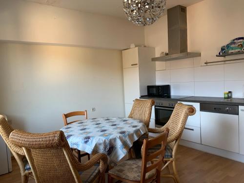 a kitchen with a table and chairs in a kitchen at Landgasthaus Klosterhof in Fischbach
