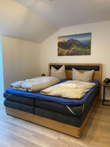a bedroom with two beds in a room at Ferienwohnung Oberallgäu Ferienpark mit Schwimmbad in Missen-Wilhams