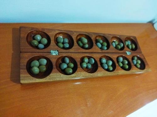 a wooden box filled with green eggs on a table at Apto Morabeza T2 Praia in Praia