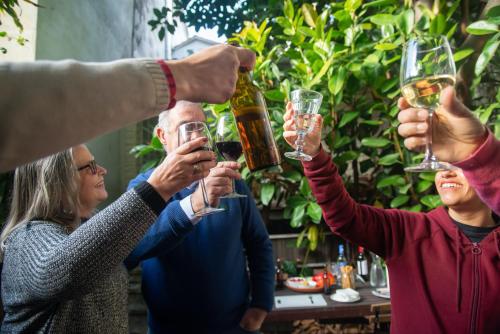 a group of people holding up wine glasses at Mintaro Hideaway in Mintaro
