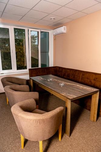 a conference room with a table and two chairs at Hotel Shengen "Шенген" in Kropyvnytskyi