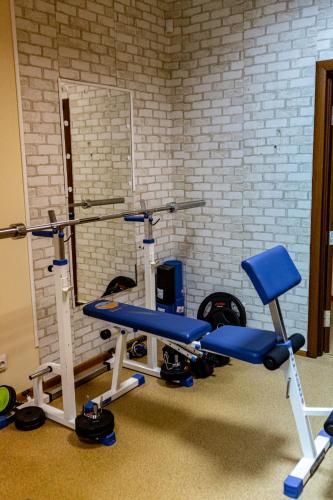 a gym with two exercise bikes and a brick wall at Hotel Shengen "Шенген" in Kropyvnytskyi