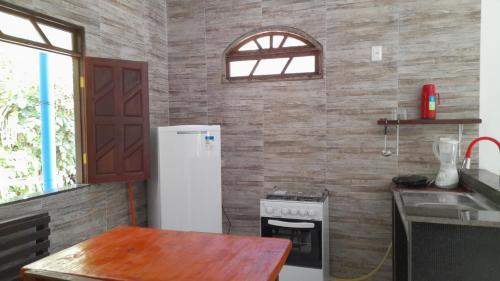 Dapur atau dapur kecil di Axe Mainha Flats e Kitnet
