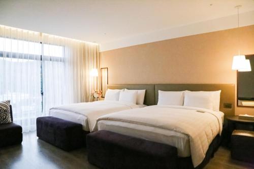 The Gaya 渡假酒店房間的床