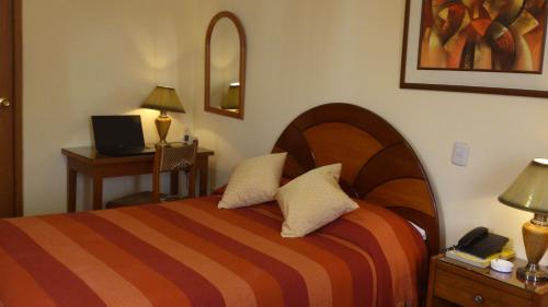 Postel nebo postele na pokoji v ubytování Copacabana Hotel