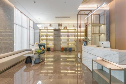 an office with a lobby with a reception desk at Atour Hotel Nanjing Olympics Sports Center CBD in Nanjing
