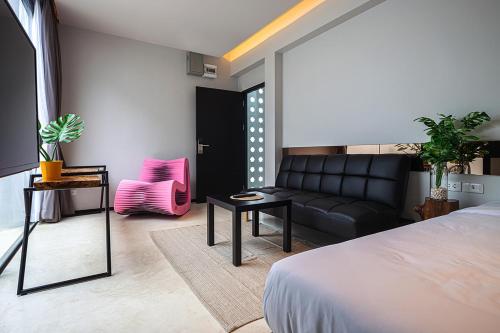 Ένα ή περισσότερα κρεβάτια σε δωμάτιο στο INNLUXPHUKET