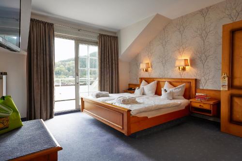 Postel nebo postele na pokoji v ubytování Göbels Landhotel
